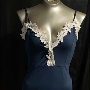 Navy blue cocktail dress with white lace. Spaghetti straps. Form fitting